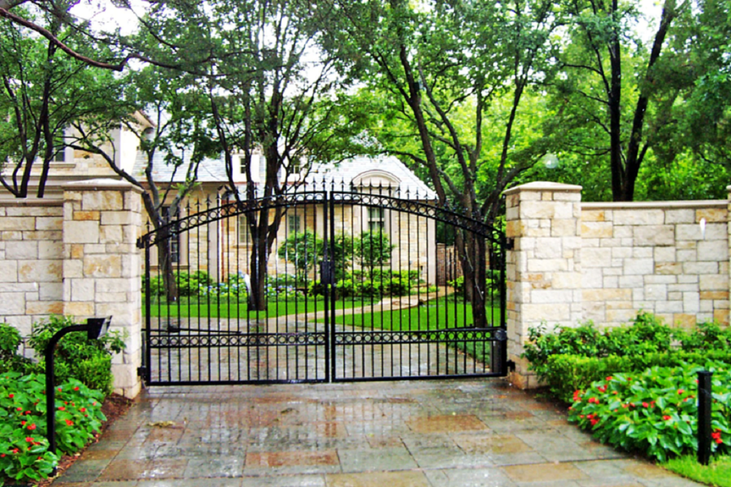 fence. iron gate with austin stone