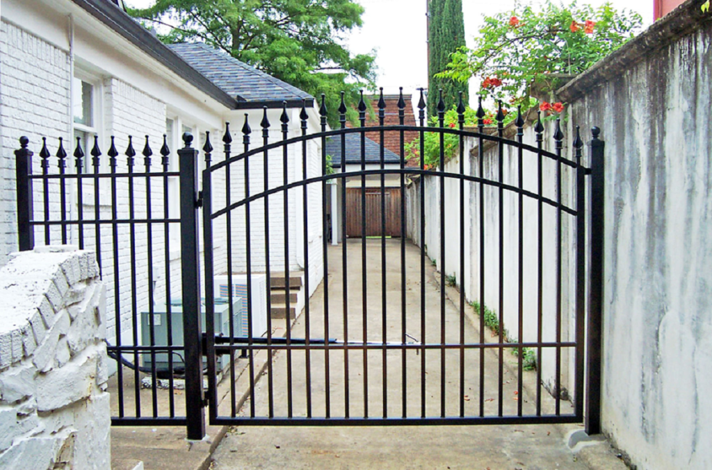 fence. narrow city driveway gate